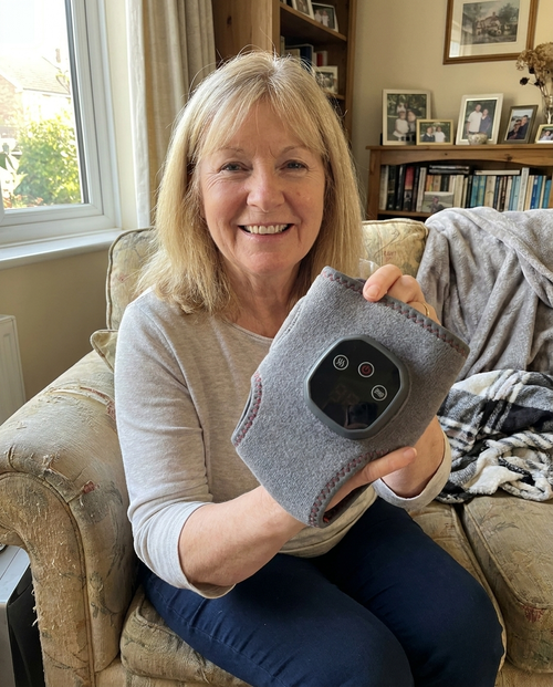 A Tend owner holding her wrap at home